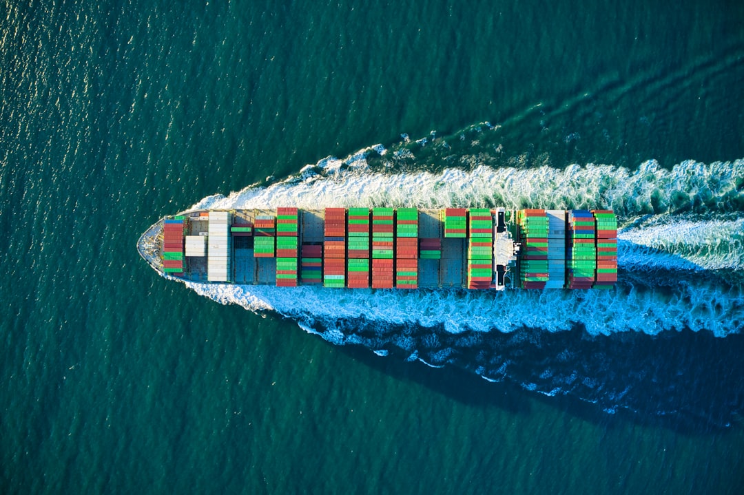 creative-approach-img Colorful cargo ship headed out to see aerial