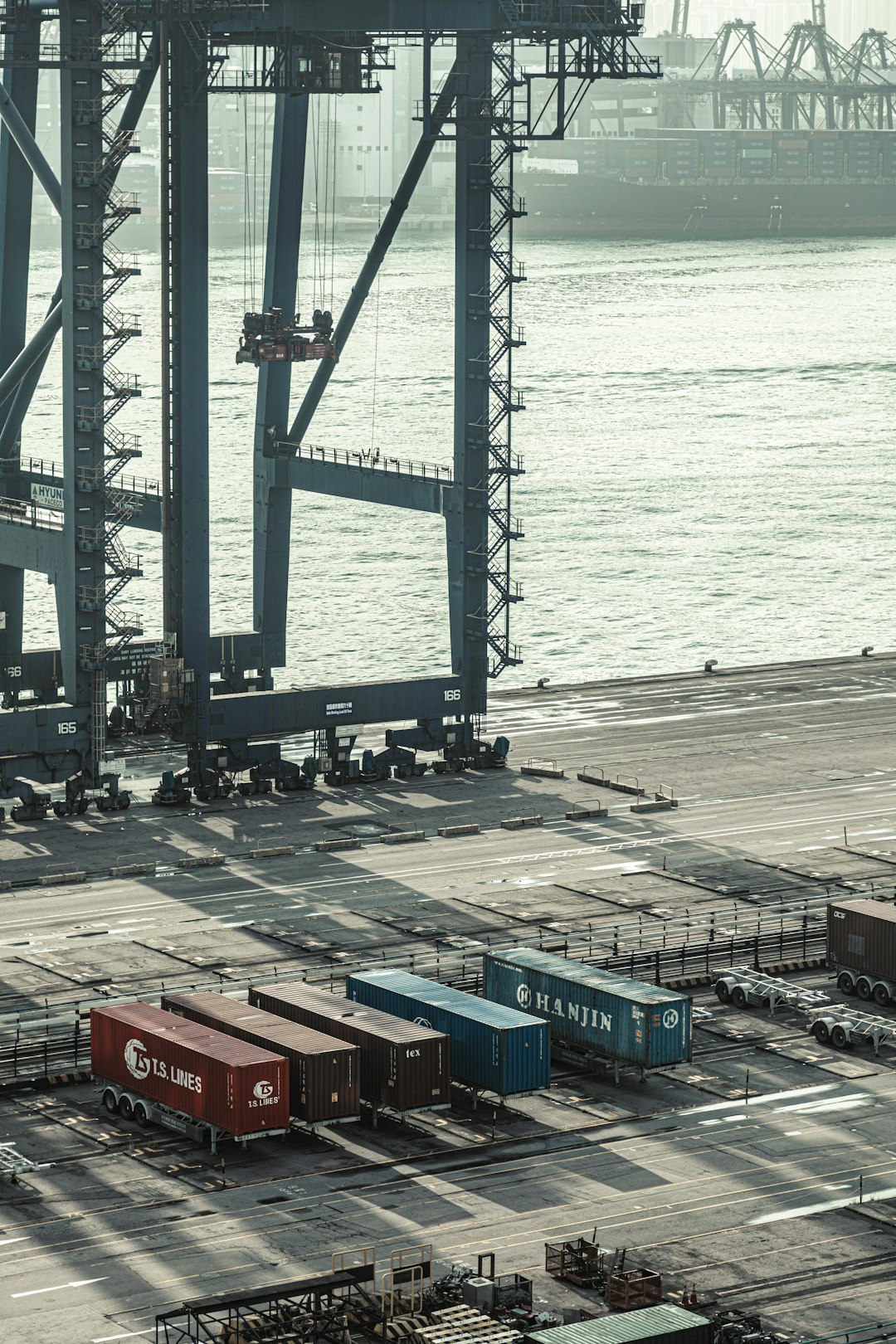 about-img blue-and-red-cargo-containers-near-body-of-water-during-daytime-zr4k6q13rrk