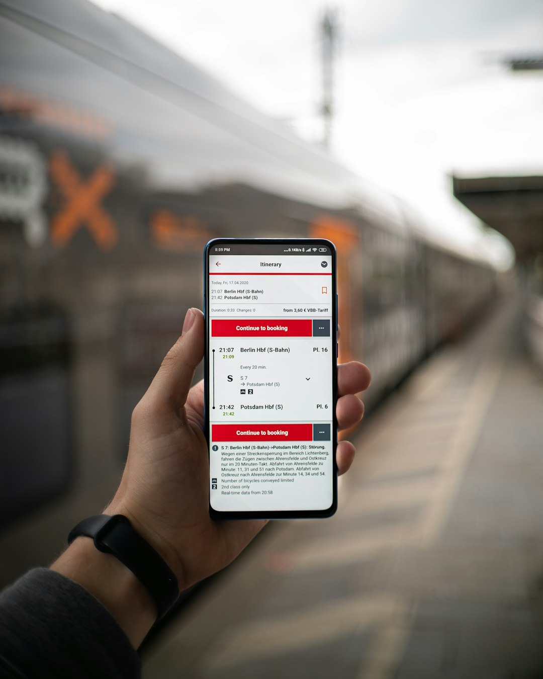 The Deutsche Bahn Streckenplaner app with a train in the background!